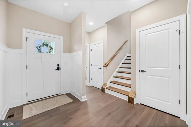 a view of entryway with wooden floor