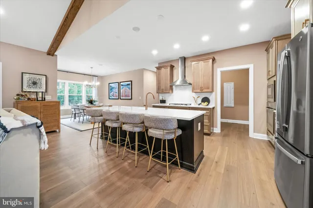 a view of a dining room kitchen with furniture and wooden floor