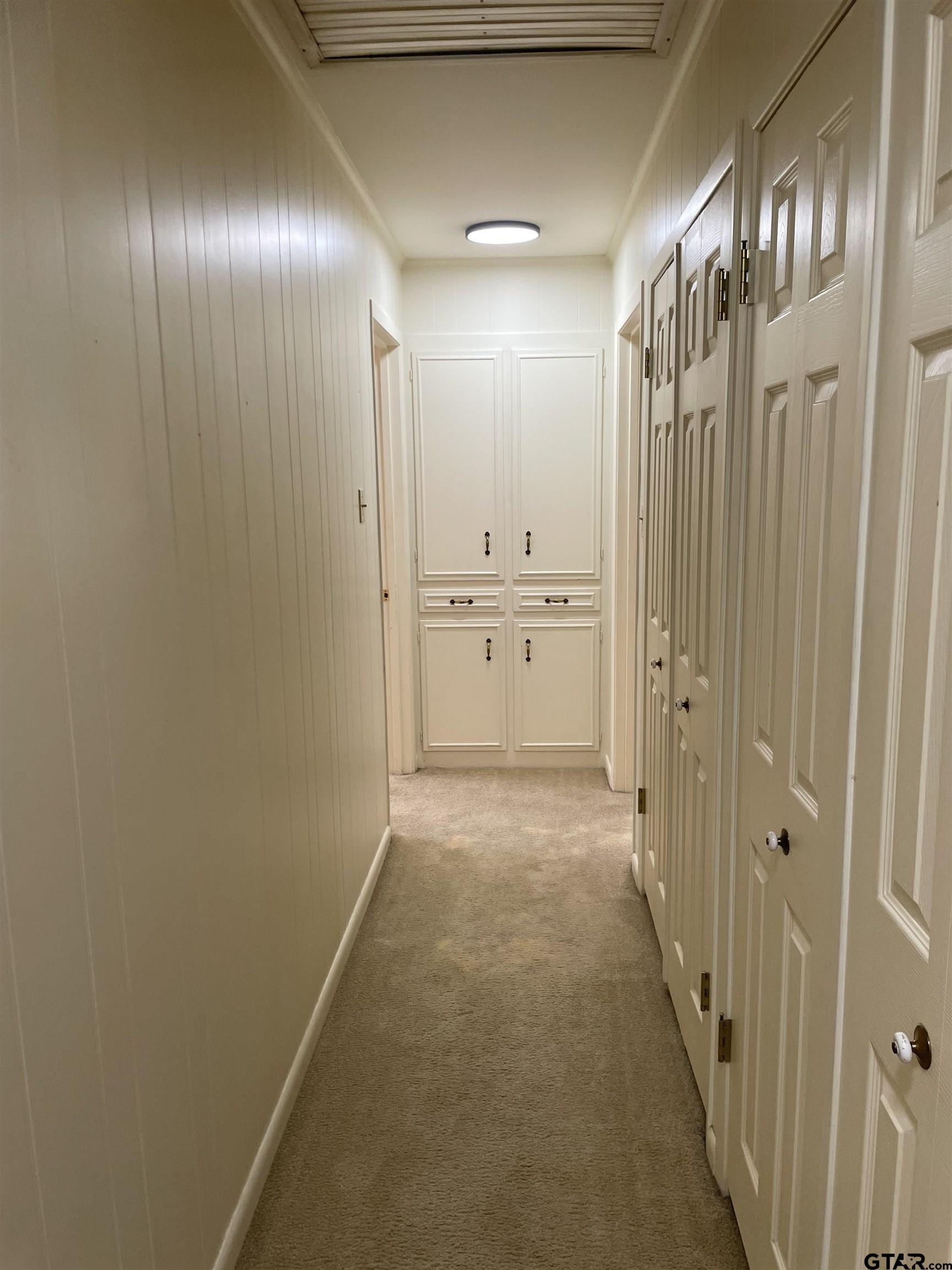 2523 Shenandoah Drive Tyler, TX 75701 - Photo 19 of 26 a view of a hallway with chandelier