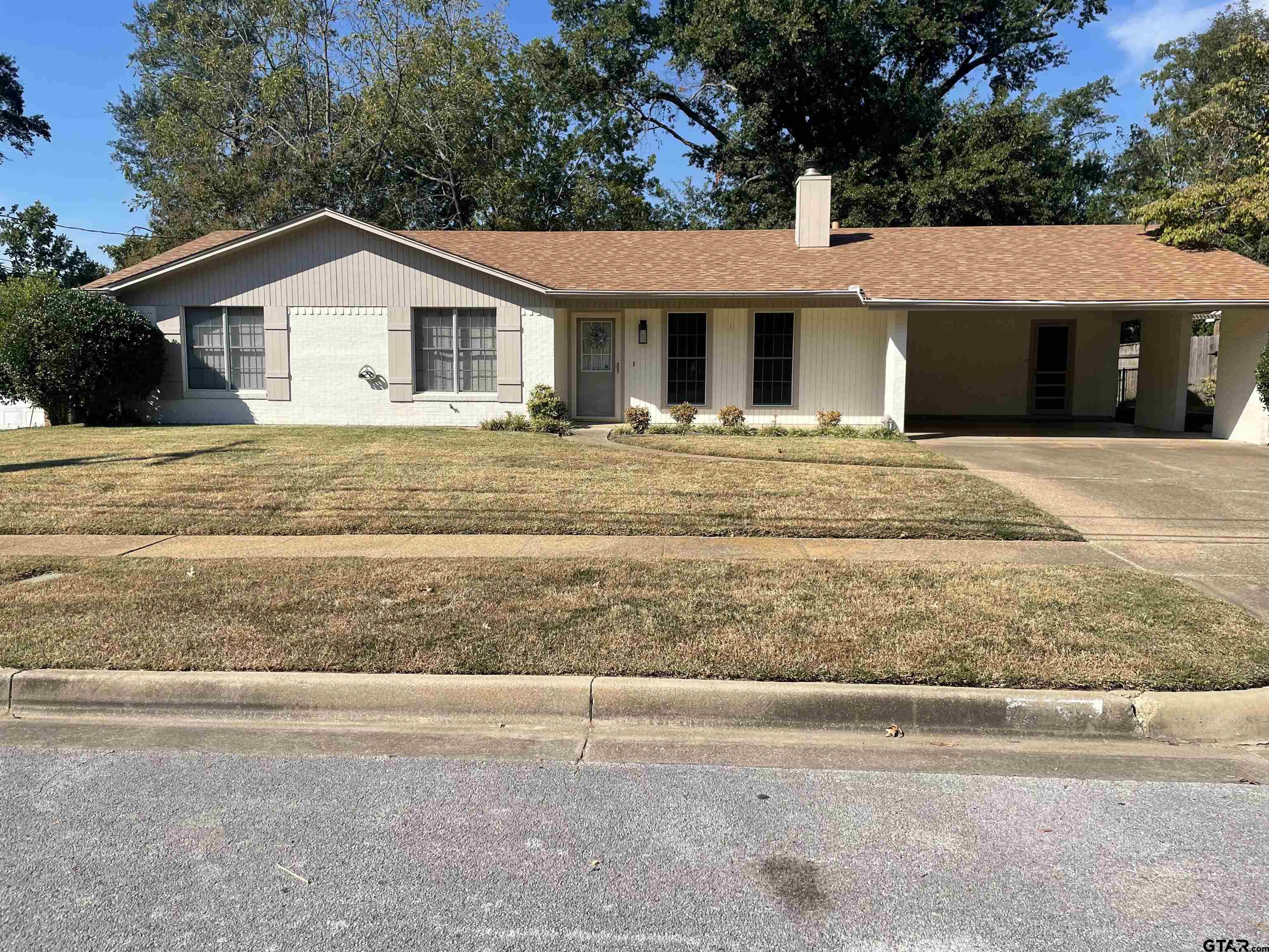 2523 Shenandoah Drive Tyler, TX 75701 - Photo 2 of 26 a front view of a house with a yard