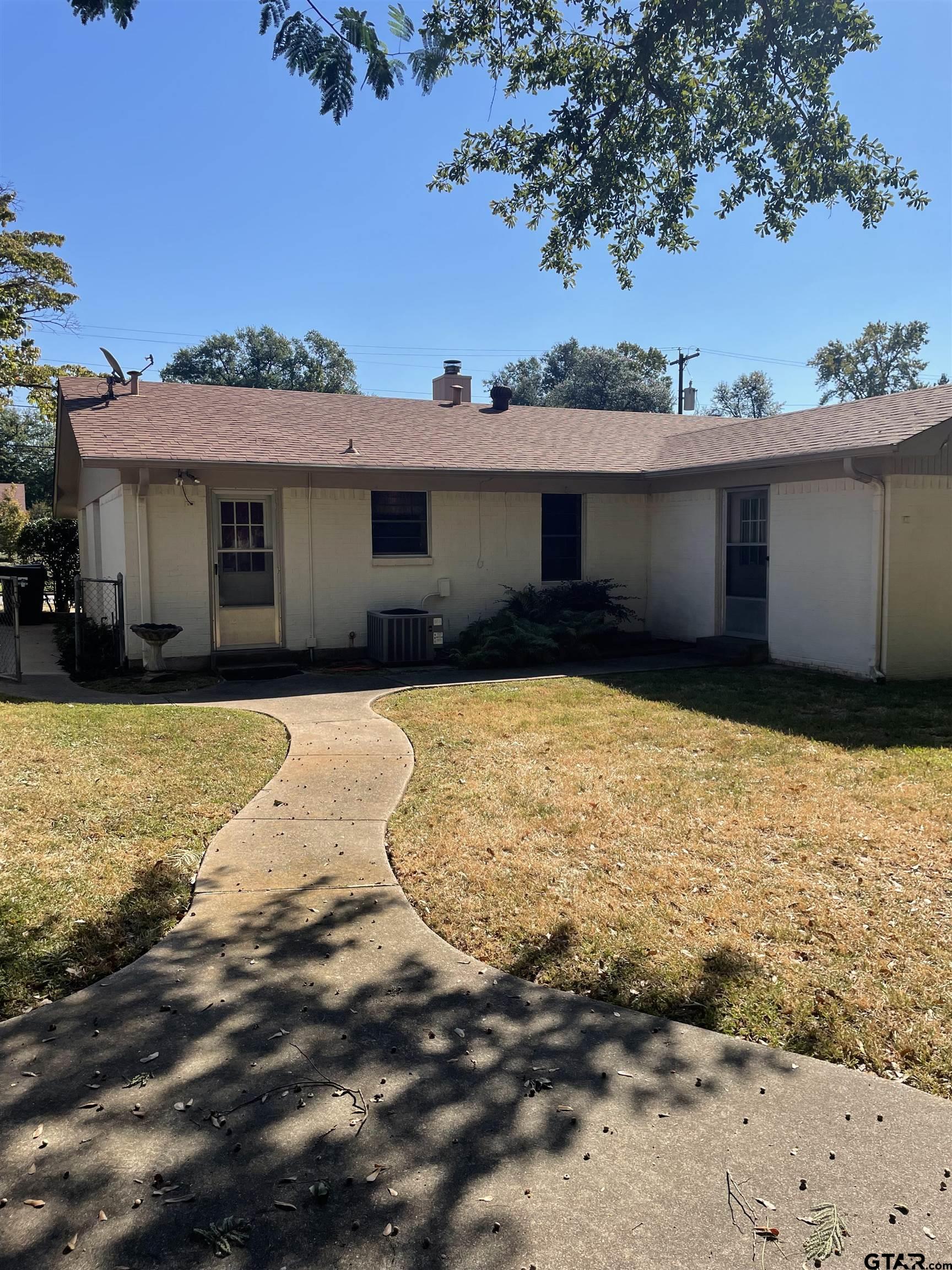 2523 Shenandoah Drive Tyler, TX 75701 - Photo 4 of 26 a view of a house with a yard