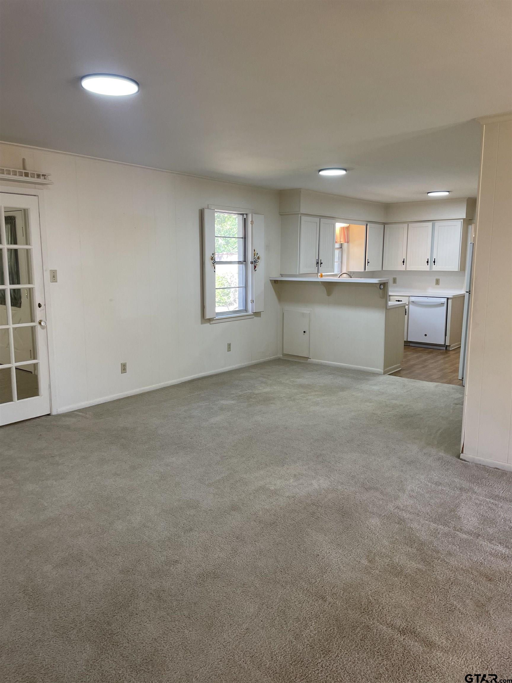 2523 Shenandoah Drive Tyler, TX 75701 - Photo 9 of 26 a view of a kitchen with a sink cabinets and a window