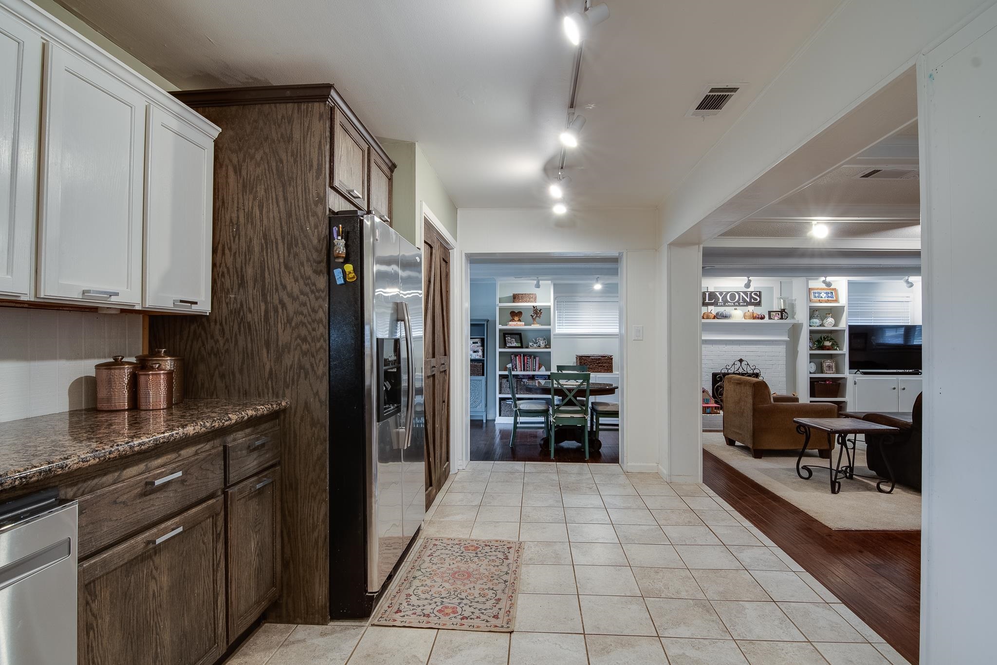 4898 Dee Road Memphis, TN 38117 - Photo 11 of 40 a kitchen with stainless steel appliances granite countertop a refrigerator and a stove top oven