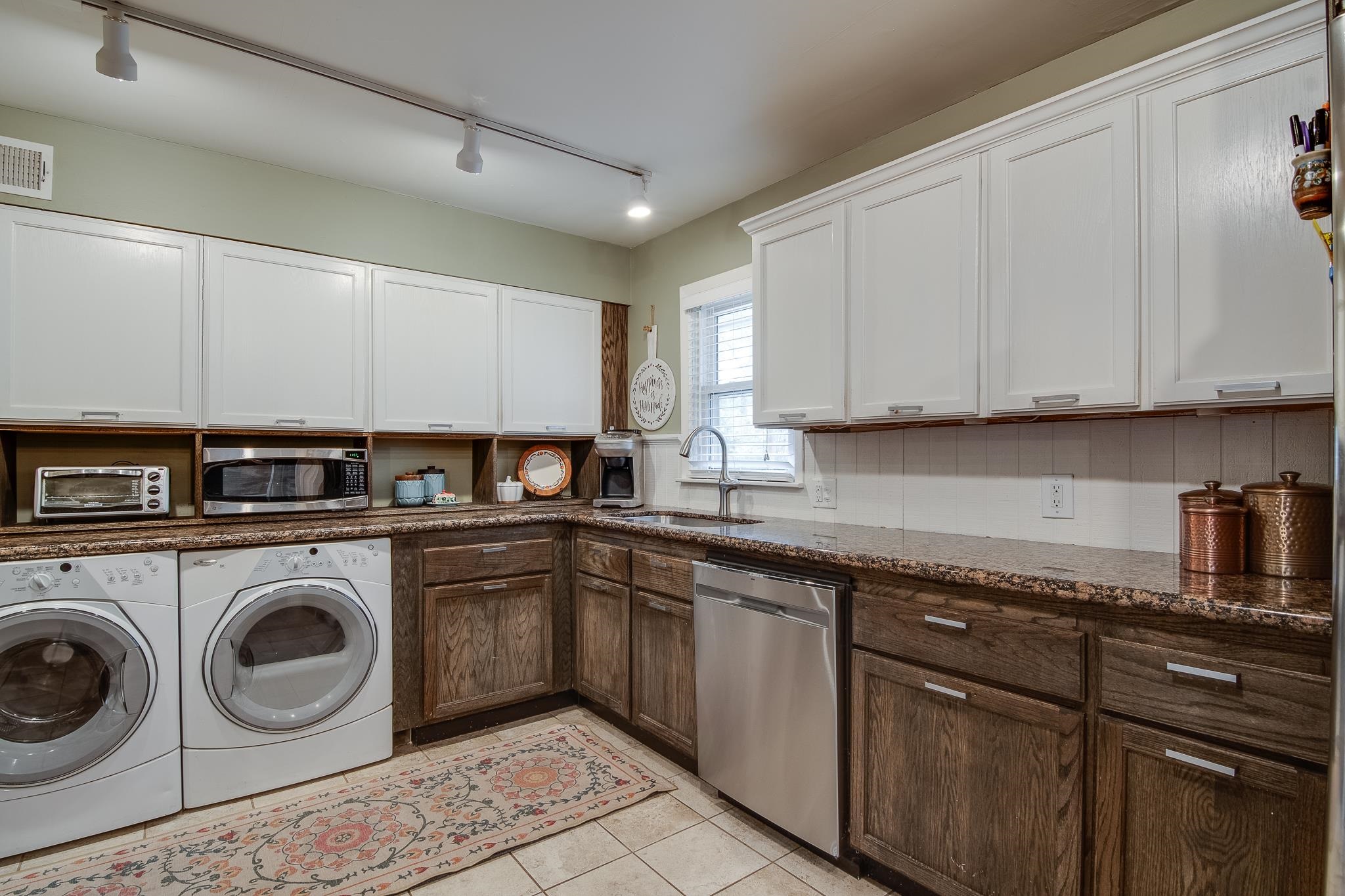 4898 Dee Road Memphis, TN 38117 - Photo 12 of 40 a kitchen with sink cabinets and washer