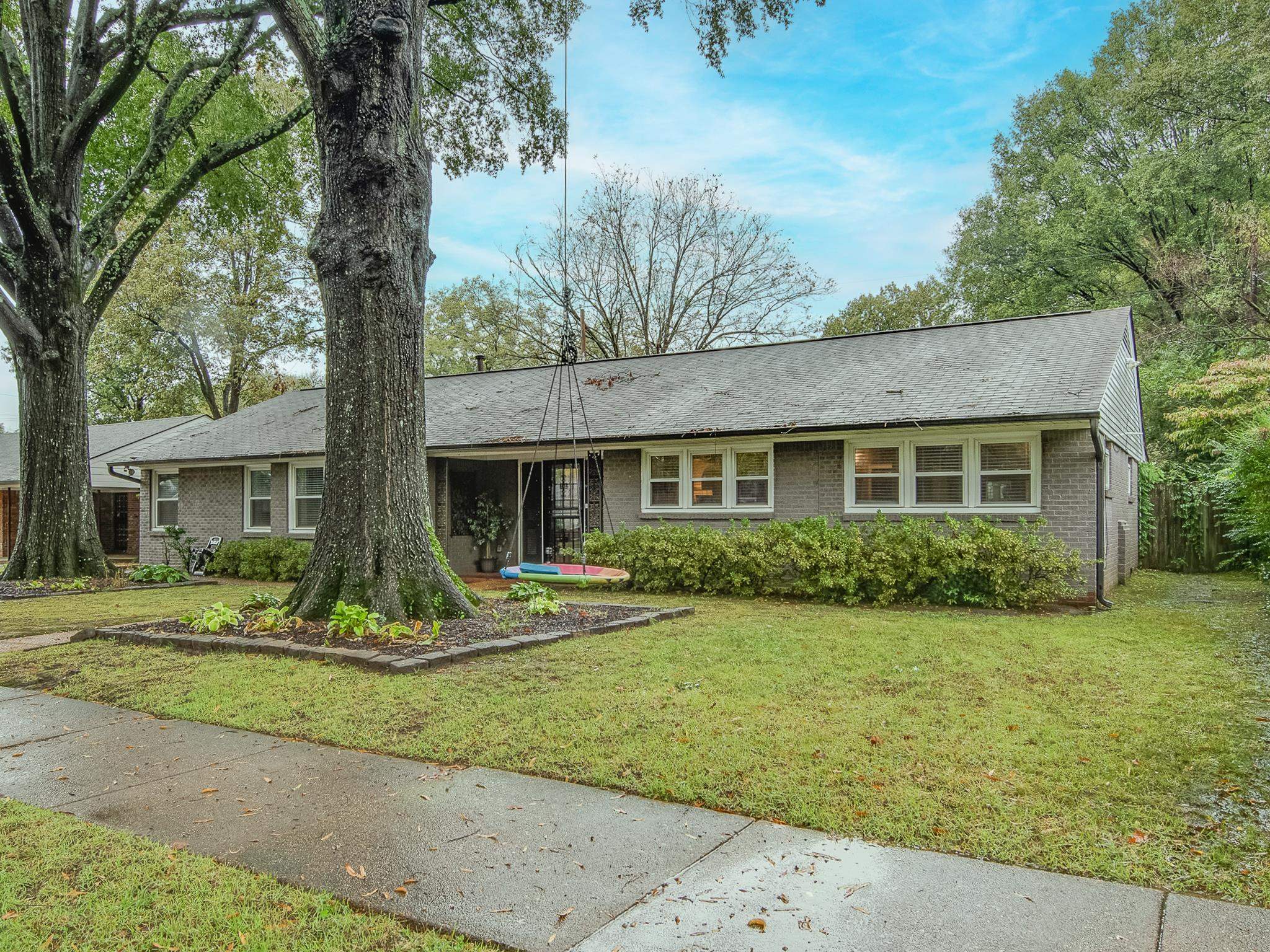 4898 Dee Road Memphis, TN 38117 - Photo 2 of 40 a front view of a house with a yard