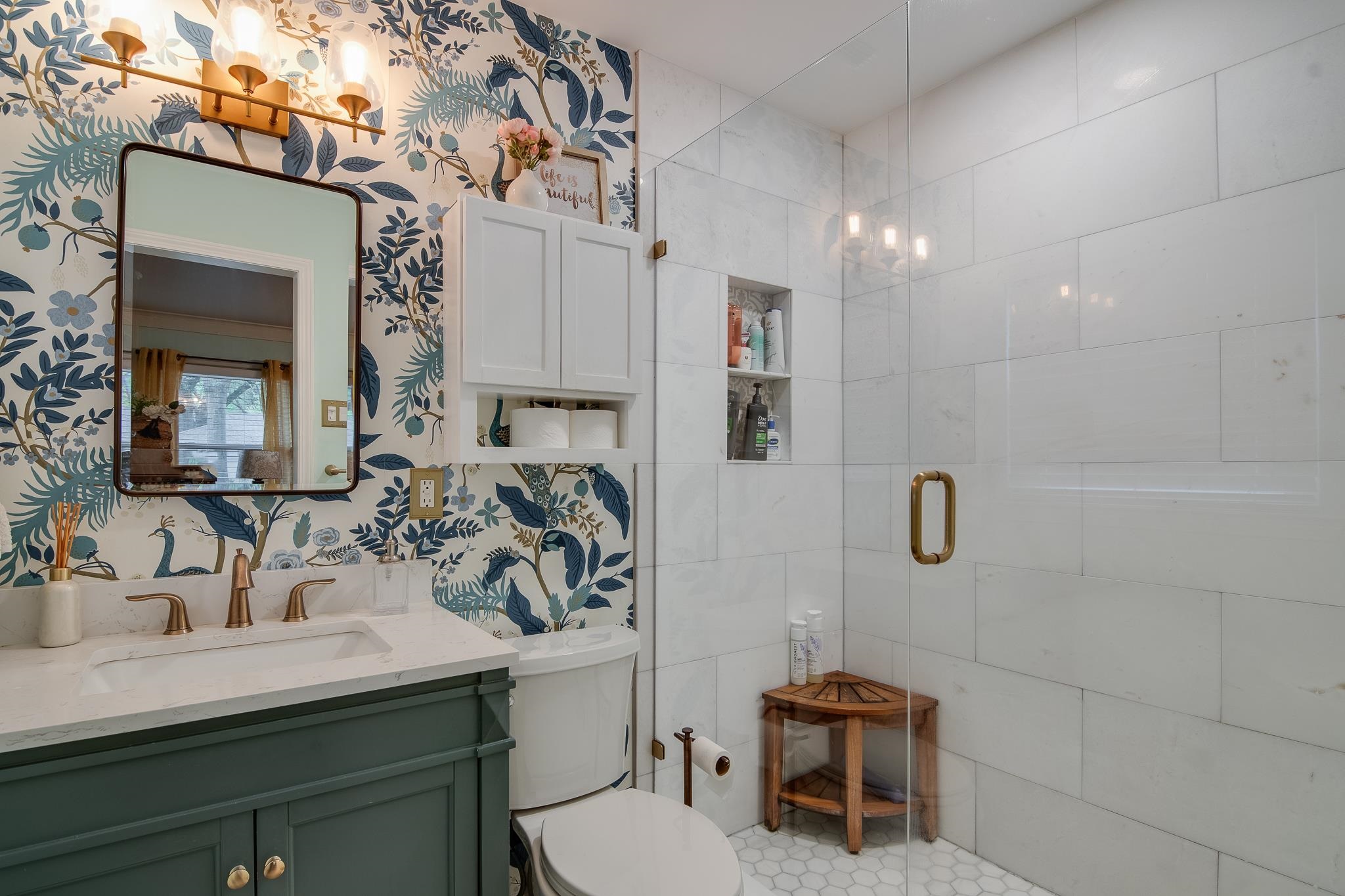 4898 Dee Road Memphis, TN 38117 - Photo 28 of 40 a bathroom with a sink a toilet and shower