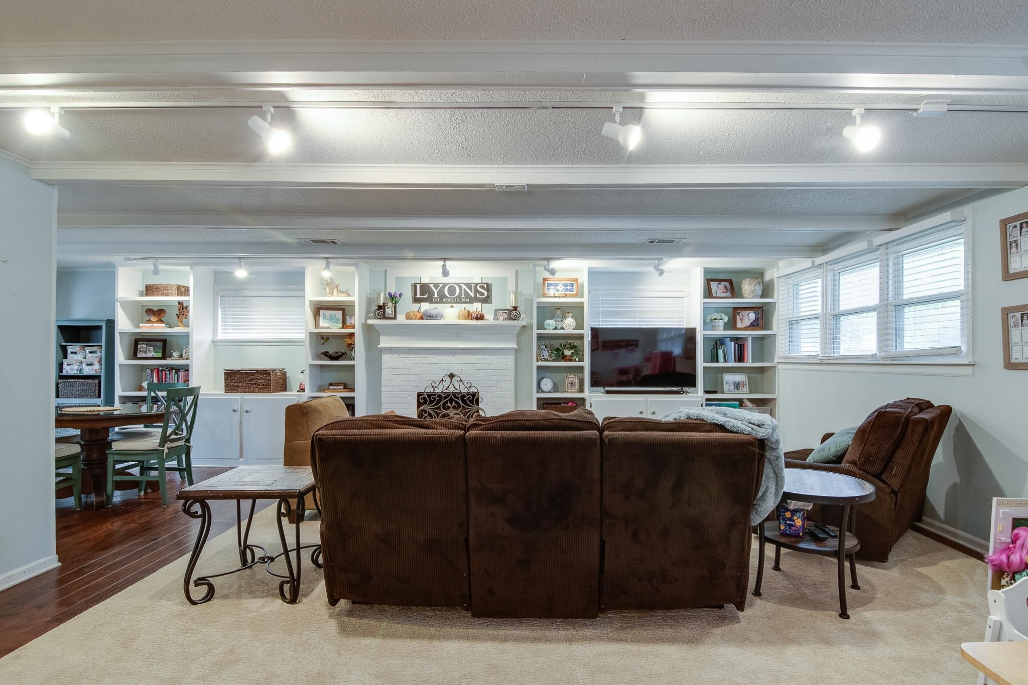 4898 Dee Road Memphis, TN 38117 - Photo 3 of 40 a living room with a couch and a flat screen tv