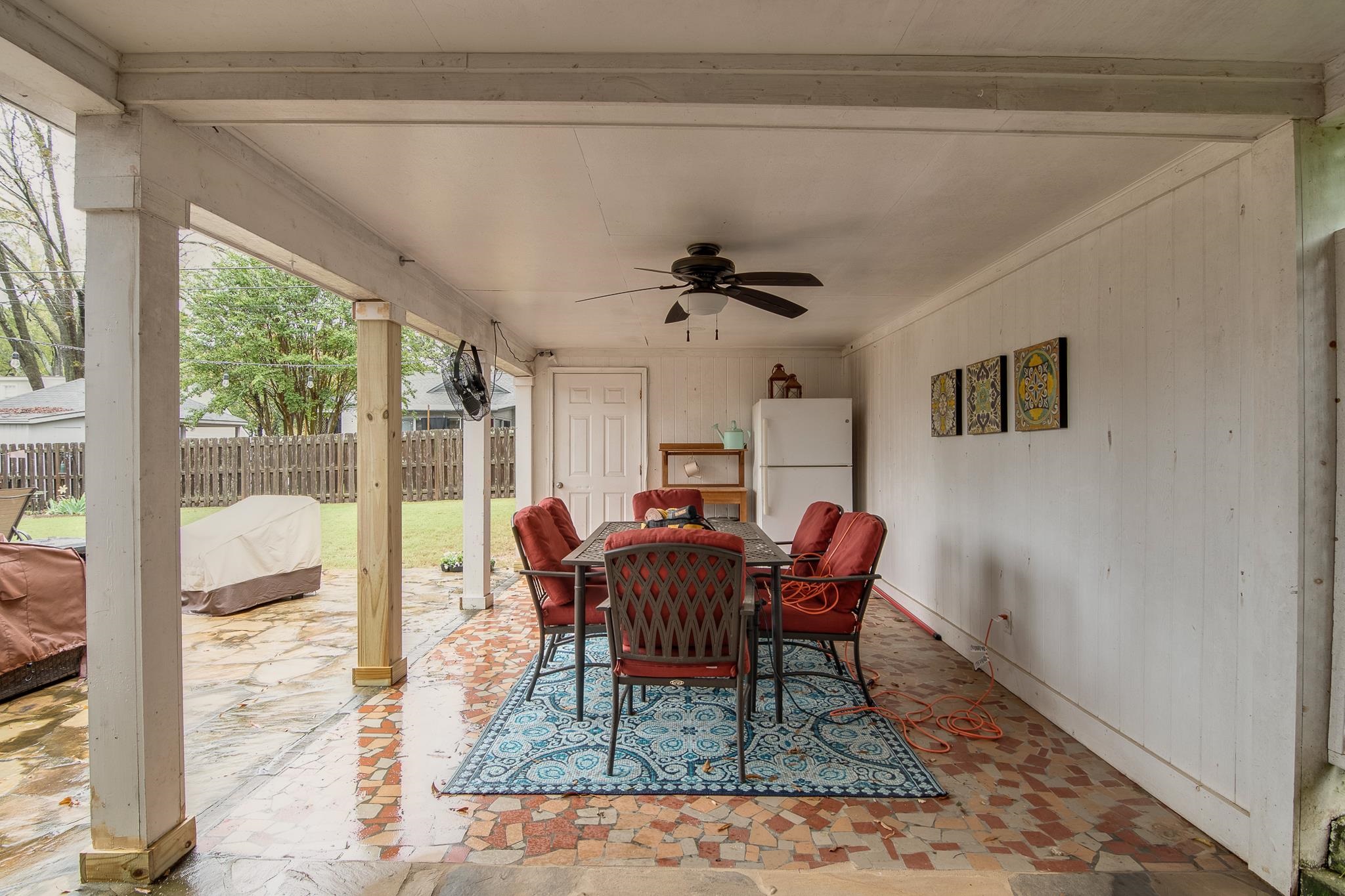 4898 Dee Road Memphis, TN 38117 - Photo 35 of 40 a dining room with furniture a rug and wooden floor