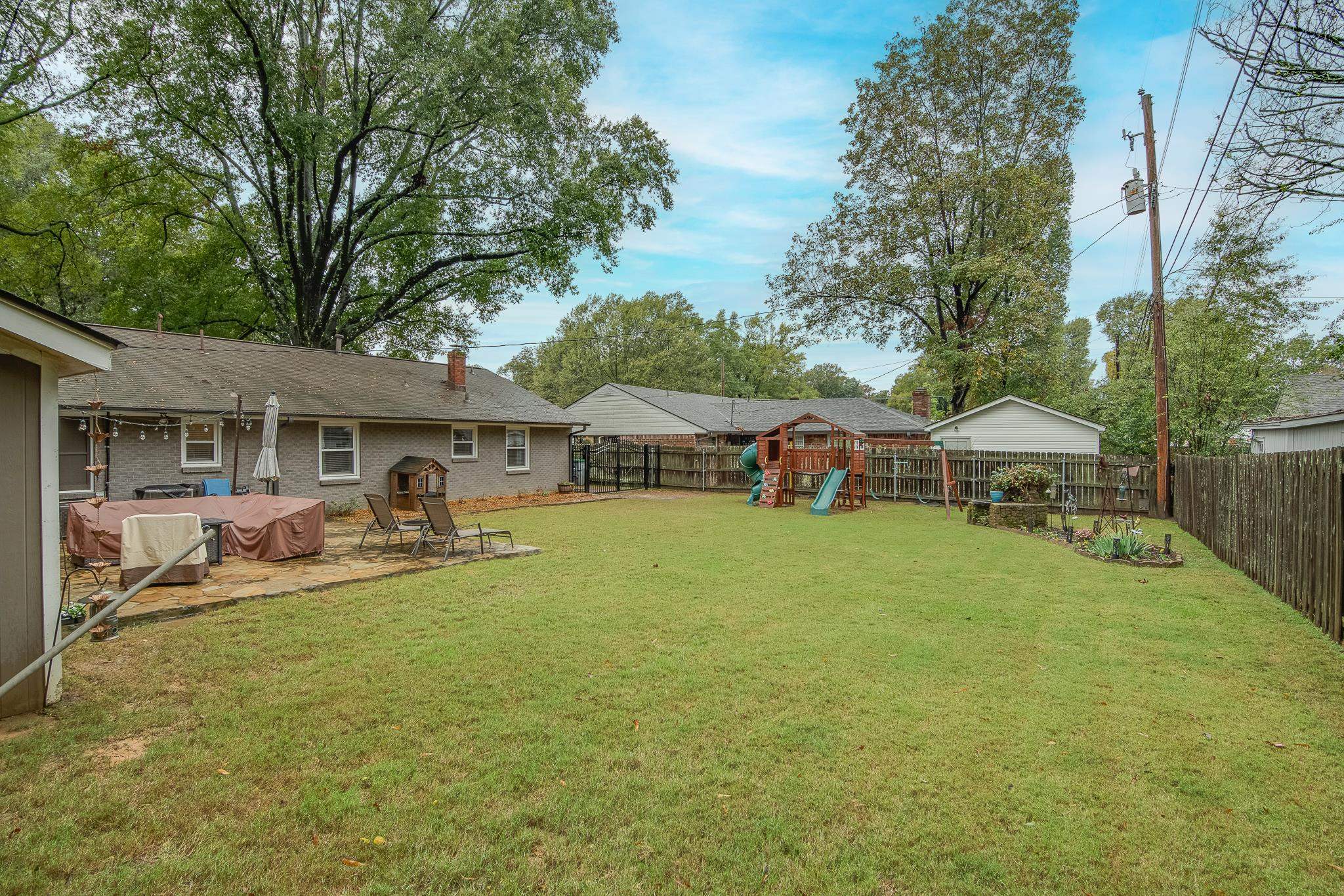 4898 Dee Road Memphis, TN 38117 - Photo 39 of 40 a front view of a house with garden and porch