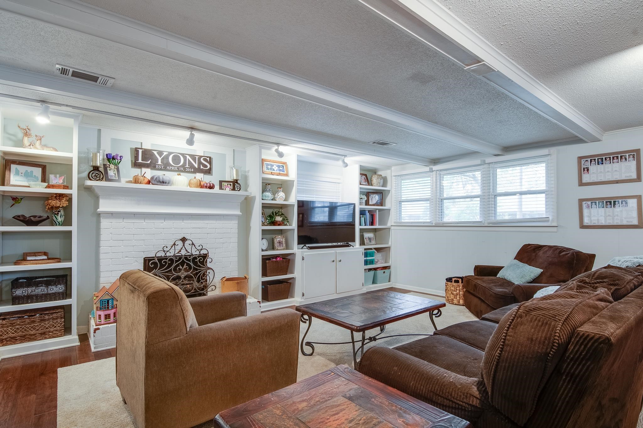 4898 Dee Road Memphis, TN 38117 - Photo 5 of 40 a living room with furniture and a fireplace