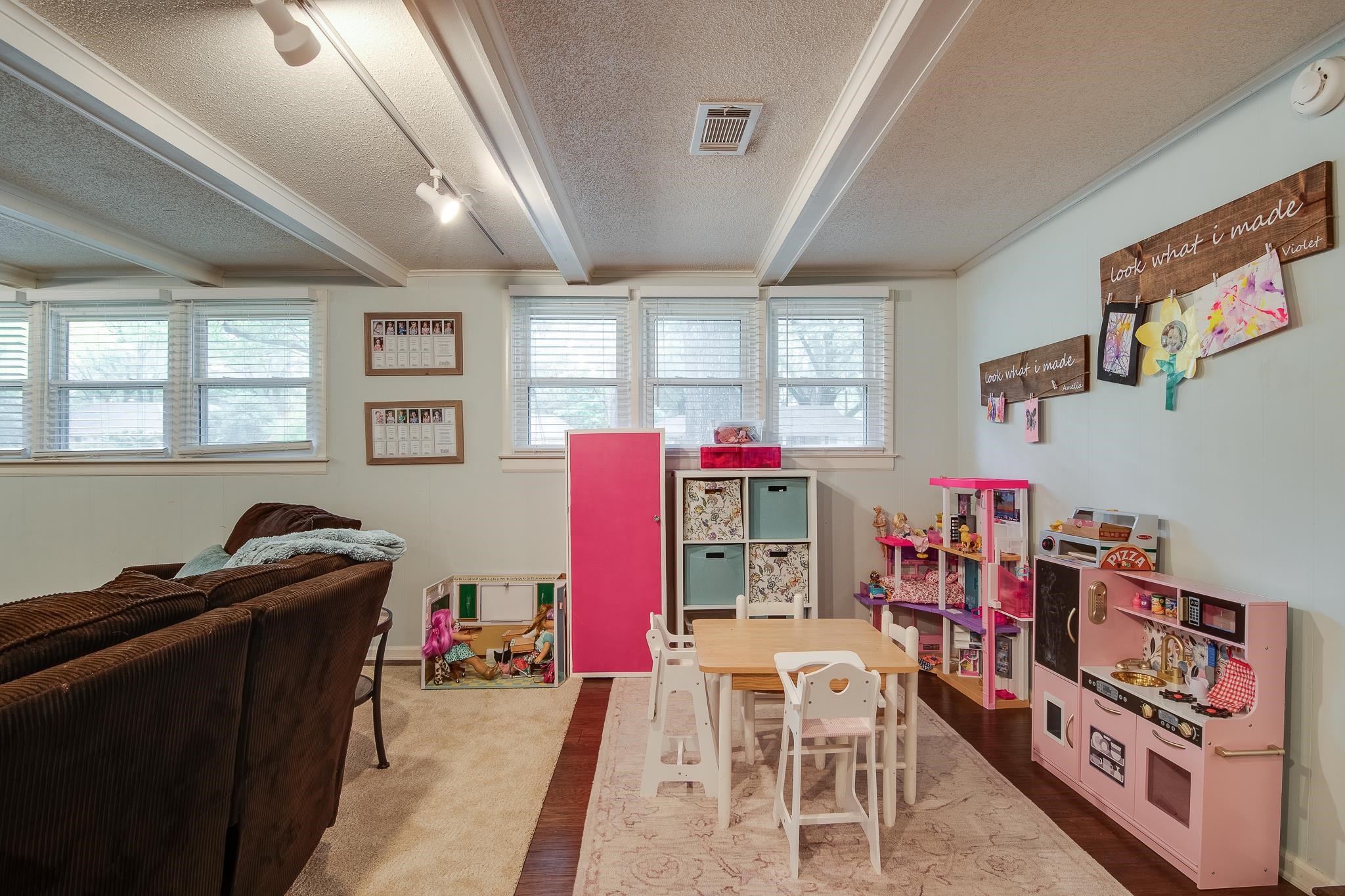 4898 Dee Road Memphis, TN 38117 - Photo 6 of 40 a living room with furniture a flat screen tv and a refrigerator