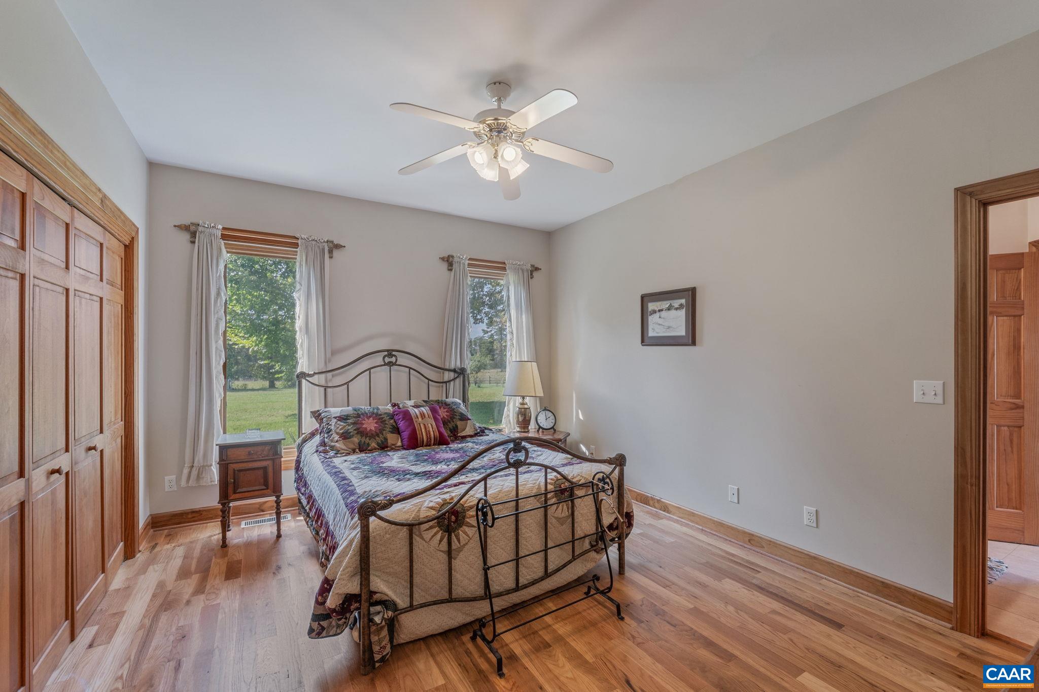 3535 Venable Road Kents Store, VA 23084 - Photo 23 of 75 a living room with a bed furniture and a window