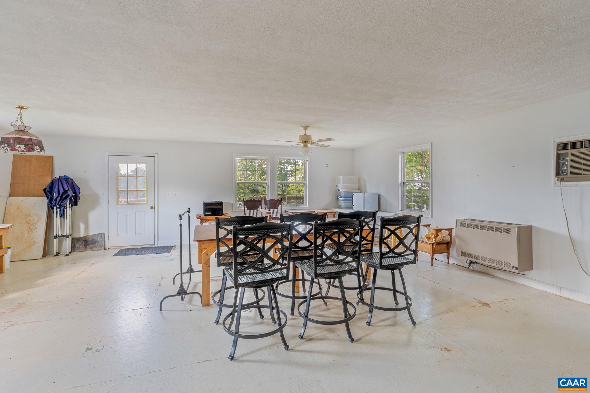 3535 Venable Road Kents Store, VA 23084 - Photo 47 of 75 a view of a dining room with furniture and chandelier