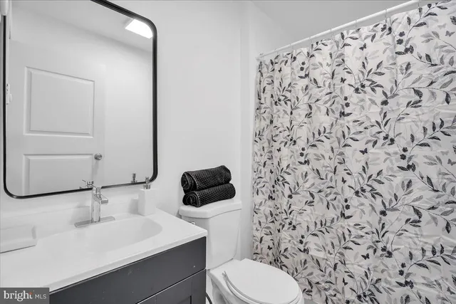 a bathroom with a toilet and a sink