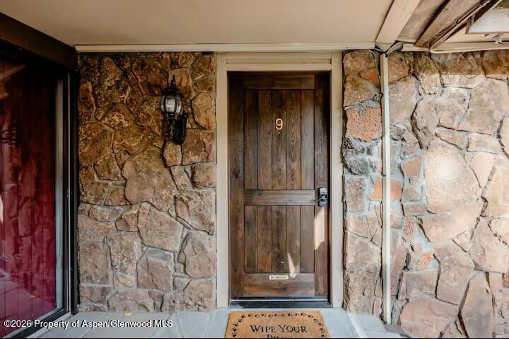 107 Aspen Mountain Road, Unit 9 Aspen, CO 81611 - Photo 14 of 19 a bathroom with a glass shower door