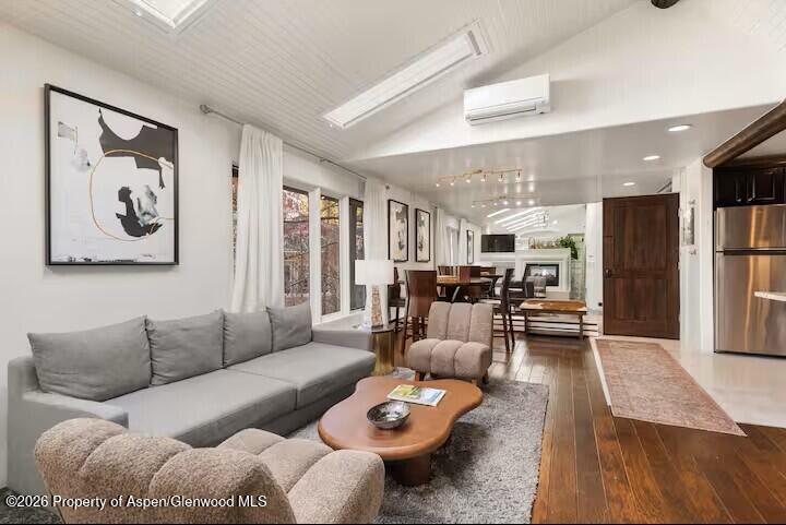 107 Aspen Mountain Road, Unit 9 Aspen, CO 81611 - Photo 5 of 19 a living room with furniture and wooden floor