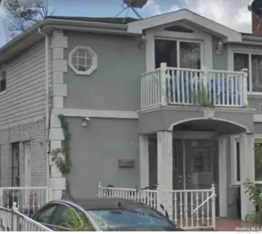 a front view of a house with parking space