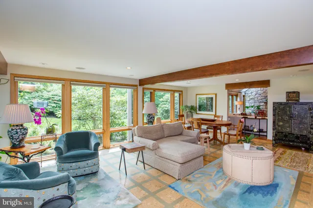 a spacious bedroom with a bed and a fireplace