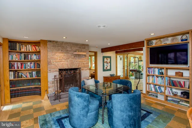 a spacious bedroom with a large bed and a large window