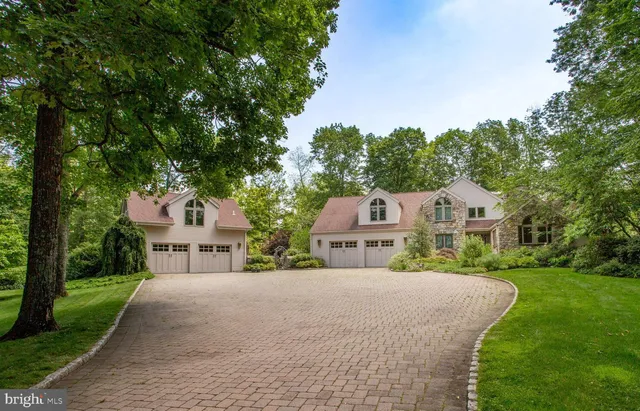 a view of a room with wooden floor and furniture