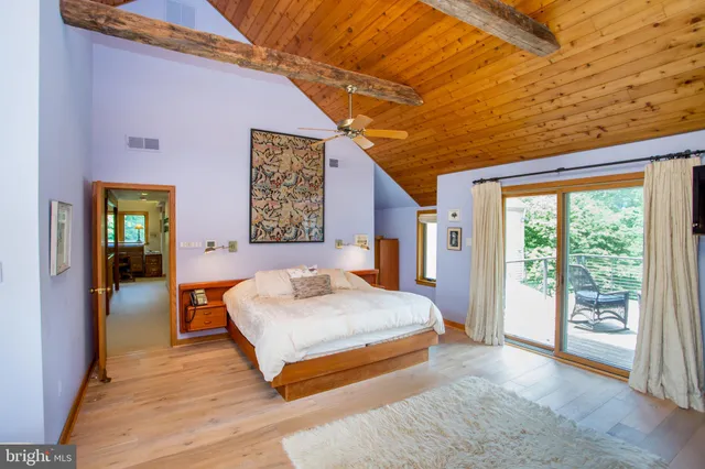 a bedroom with furniture and a window