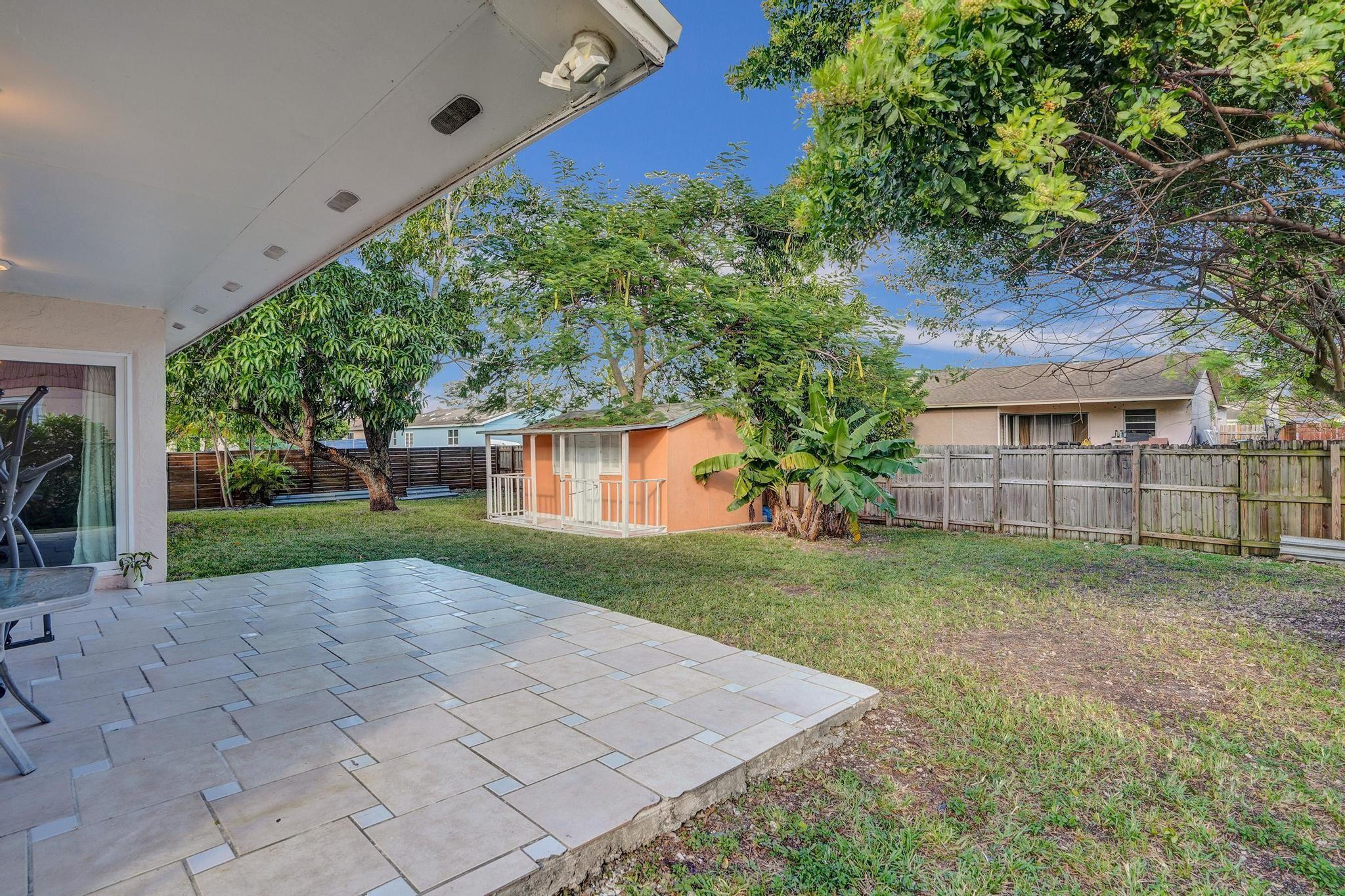 26205 Southwest 133rd Court Homestead, FL 33032 - Photo 13 of 45 a view of a house with a yard
