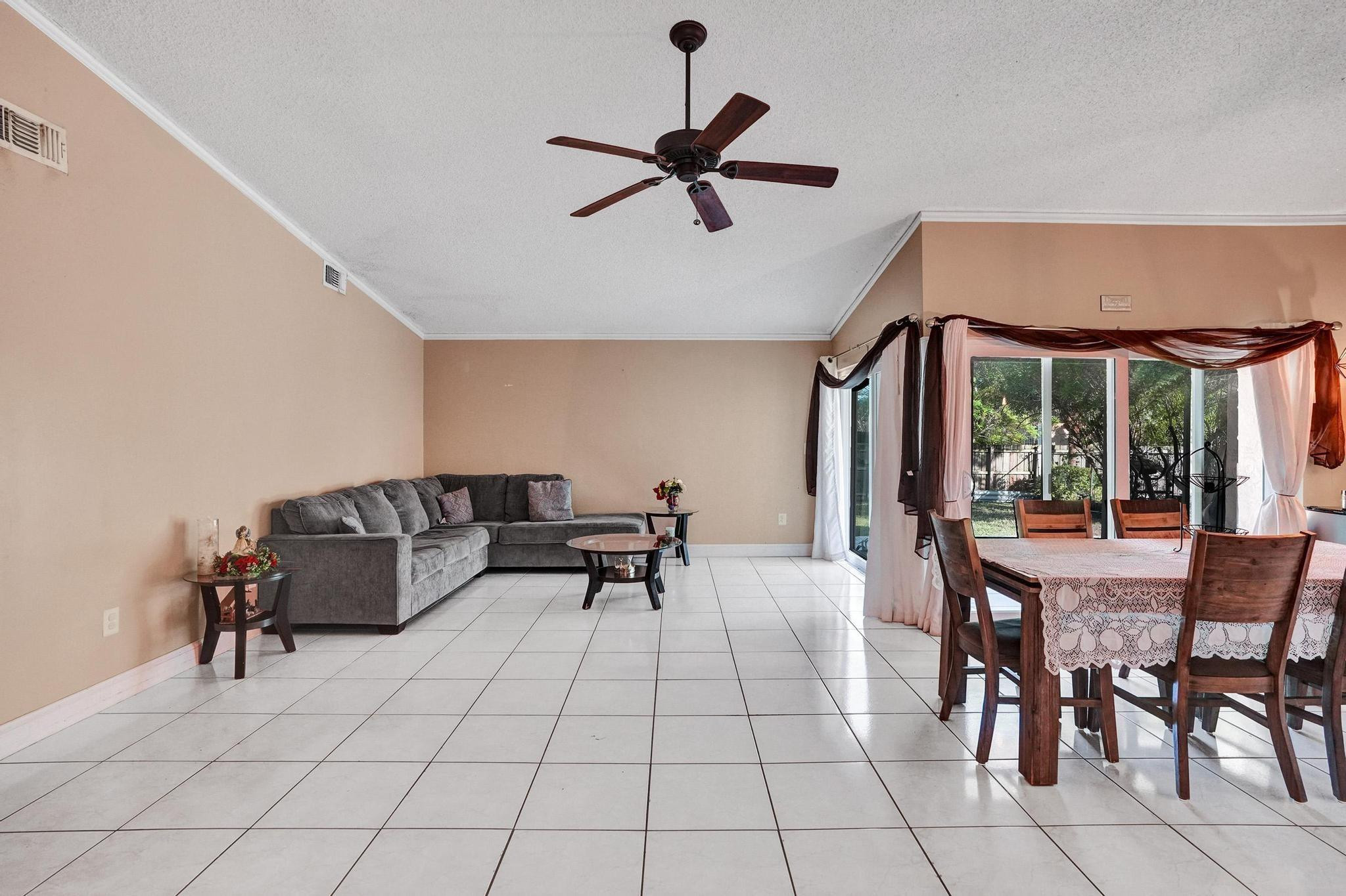 26205 Southwest 133rd Court Homestead, FL 33032 - Photo 16 of 45 a living room with furniture and a ceiling fan