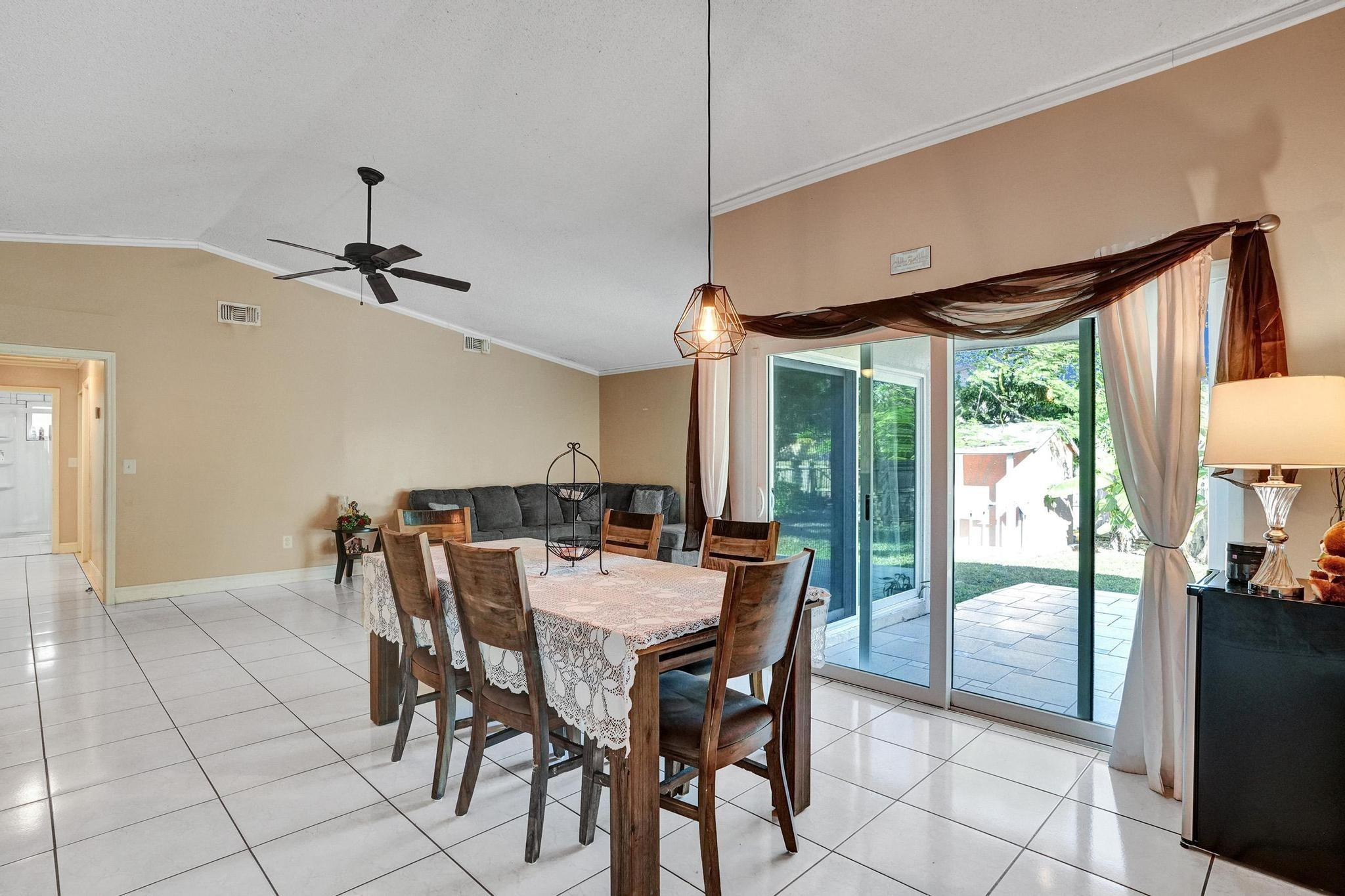 26205 Southwest 133rd Court Homestead, FL 33032 - Photo 19 of 45 a view of a dining room with furniture window and outside view
