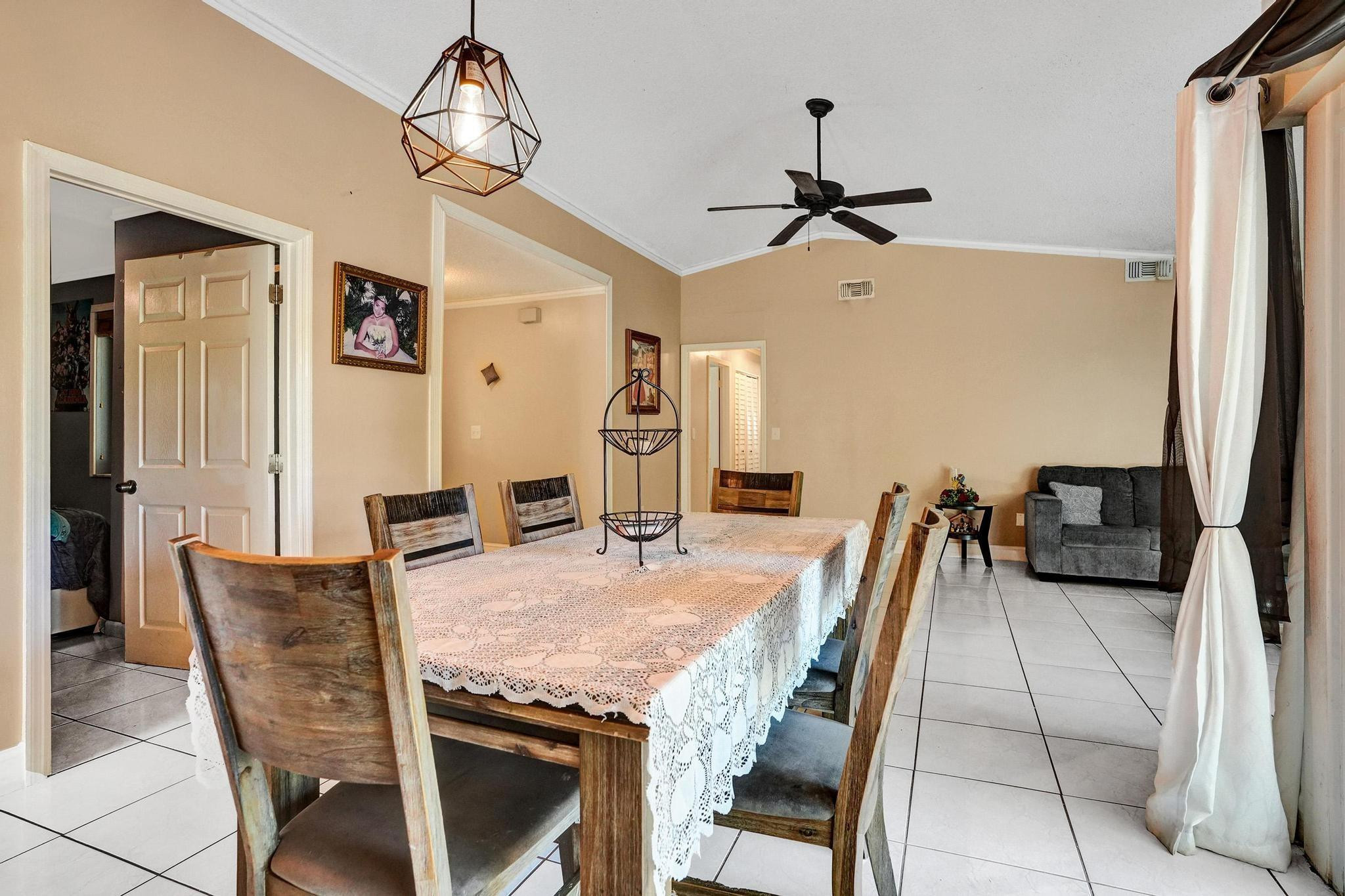 26205 Southwest 133rd Court Homestead, FL 33032 - Photo 21 of 45 a dining room with furniture and window