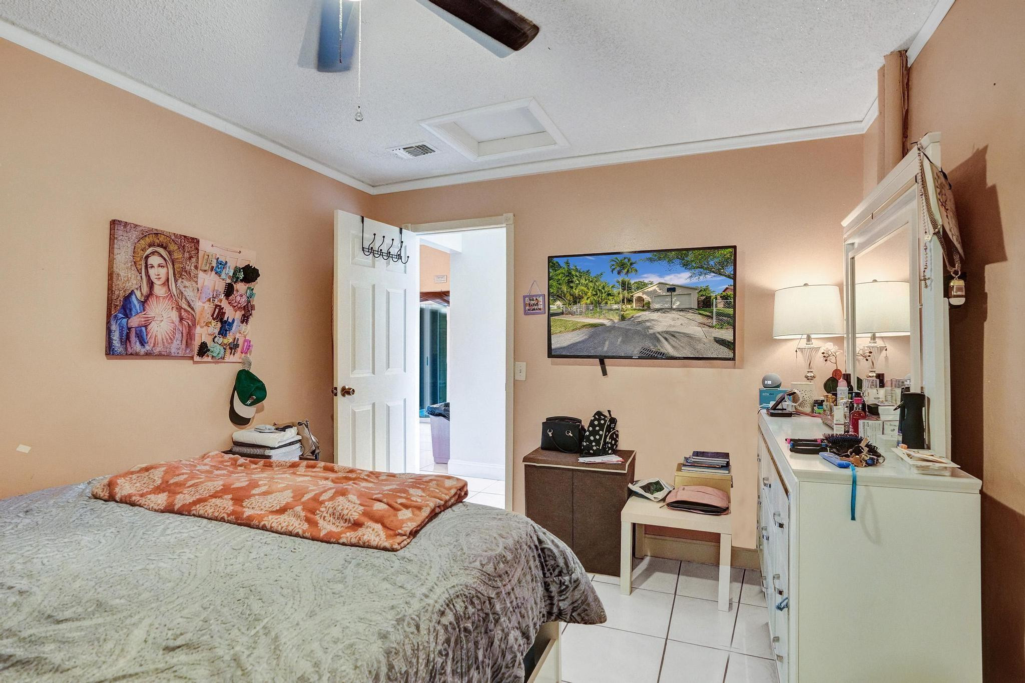 26205 Southwest 133rd Court Homestead, FL 33032 - Photo 26 of 45 a bedroom with a bed and furniture