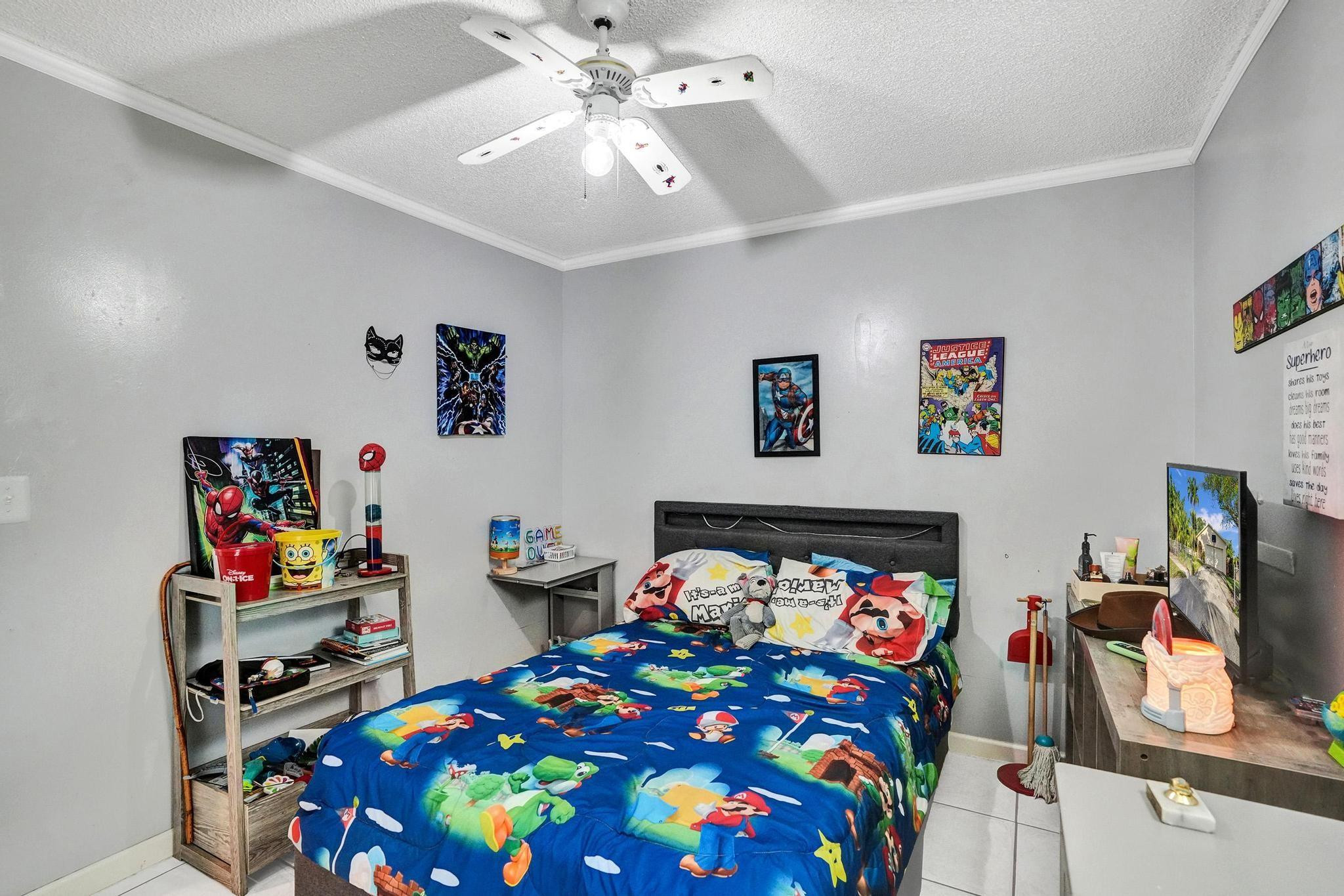 26205 Southwest 133rd Court Homestead, FL 33032 - Photo 32 of 45 a bedroom with a bed and furniture