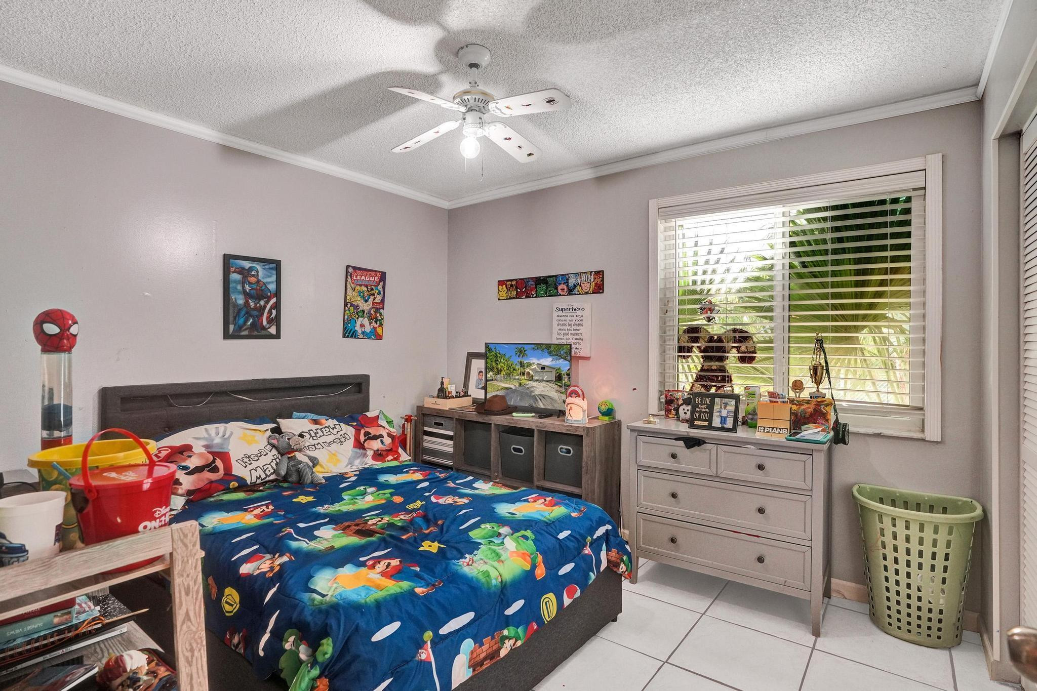 26205 Southwest 133rd Court Homestead, FL 33032 - Photo 33 of 45 a bedroom with a bed and a window