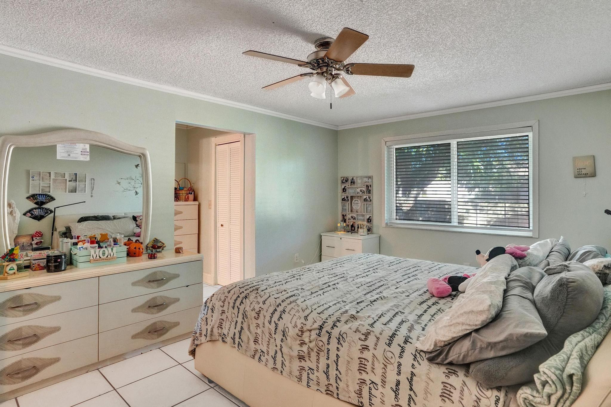 26205 Southwest 133rd Court Homestead, FL 33032 - Photo 37 of 45 a bed room with a bed and a window