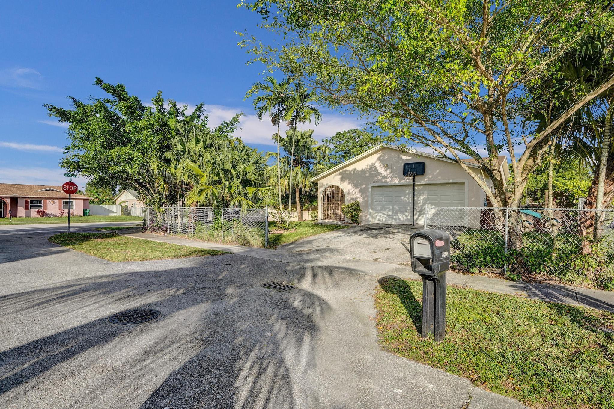26205 Southwest 133rd Court Homestead, FL 33032 - Photo 4 of 45 a view of yard along with trees