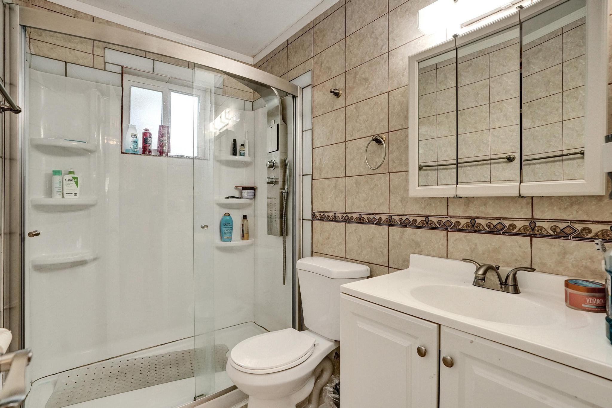 26205 Southwest 133rd Court Homestead, FL 33032 - Photo 41 of 45 a bathroom with a sink a toilet and shower