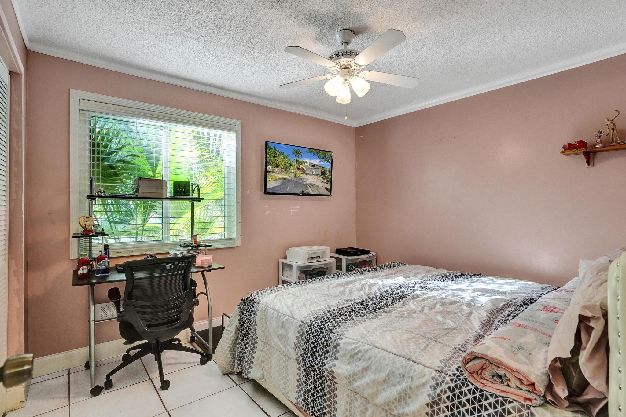 26205 Southwest 133rd Court Homestead, FL 33032 - Photo 44 of 45 a bedroom with a bed and a window