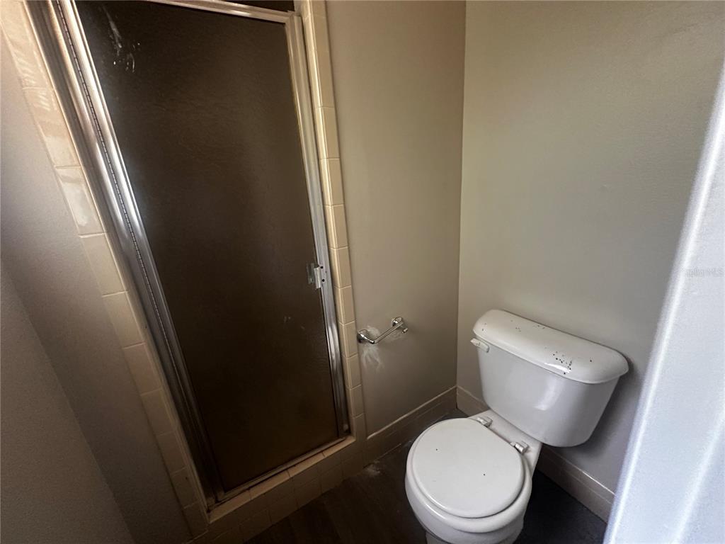 66 Silver Lane Ocala, FL 34472 - Photo 8 of 10 a white toilet sitting next to a sink