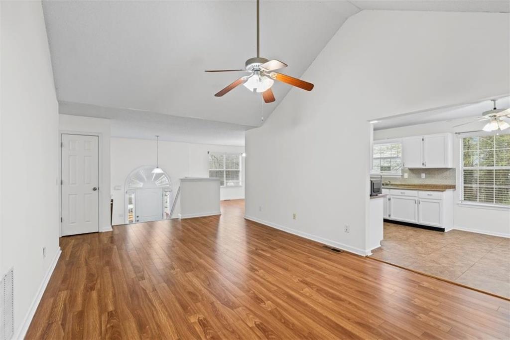 2242 Rocksram Court Buford, GA 30519 - Photo 12 of 52 a view of empty room with wooden floor