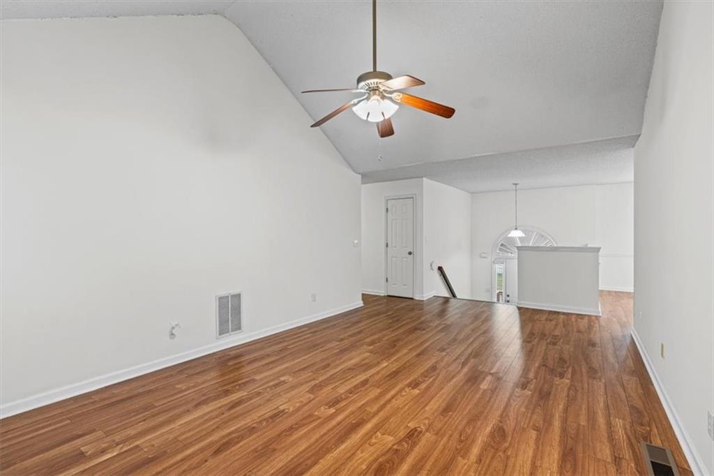 2242 Rocksram Court Buford, GA 30519 - Photo 13 of 52 a view of empty room with wooden floor