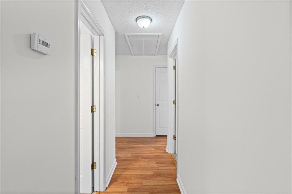 2242 Rocksram Court Buford, GA 30519 - Photo 25 of 52 a view of a bathroom from a hallway