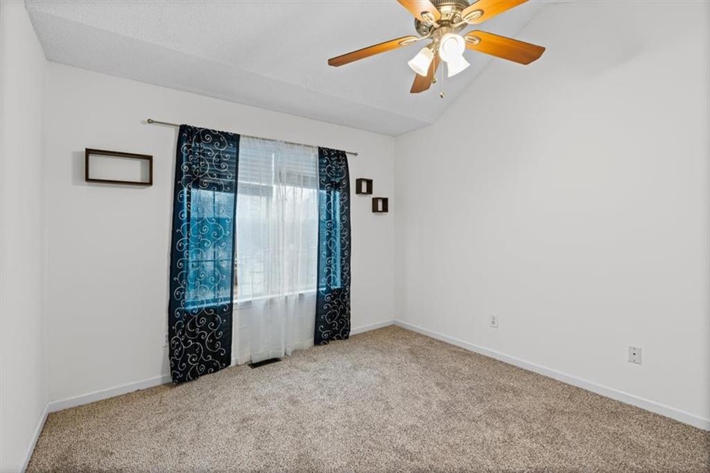 2242 Rocksram Court Buford, GA 30519 - Photo 31 of 52 an empty room with closet and windows
