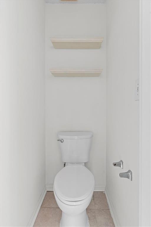 2242 Rocksram Court Buford, GA 30519 - Photo 36 of 52 a white toilet sitting next to a shower