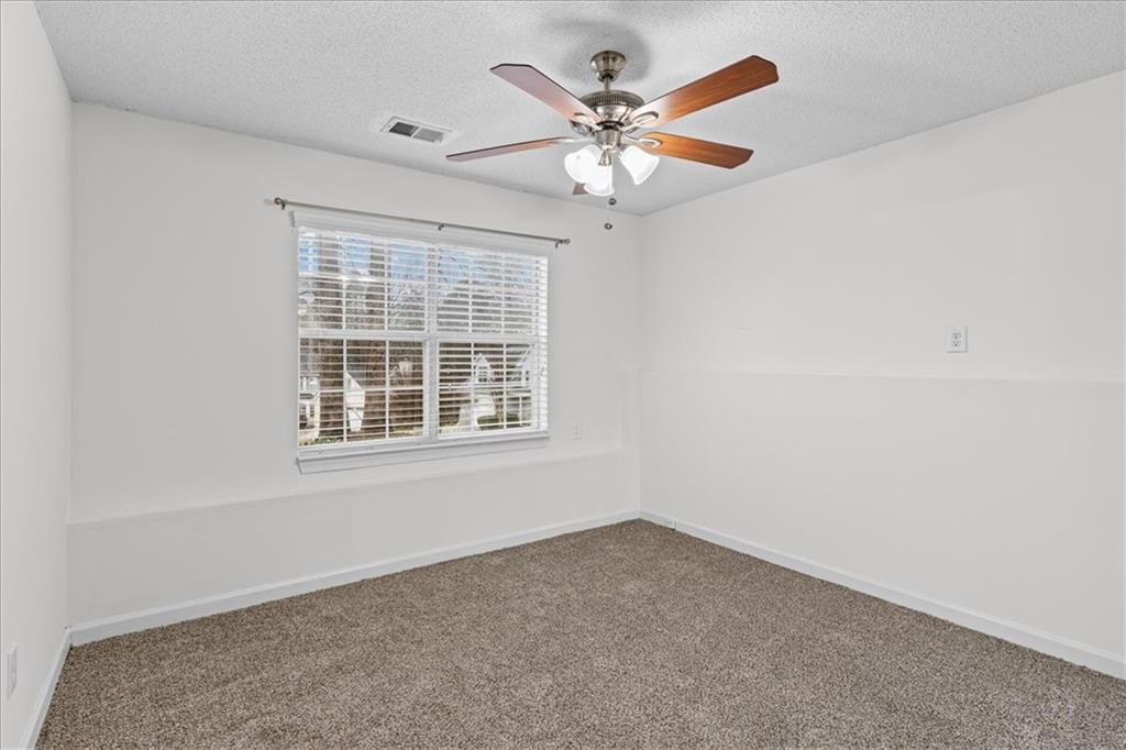 2242 Rocksram Court Buford, GA 30519 - Photo 38 of 52 an empty room with a window
