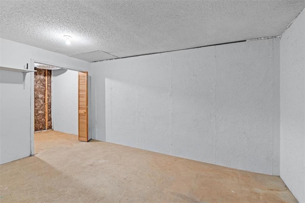 2242 Rocksram Court Buford, GA 30519 - Photo 39 of 52 a view of an empty room