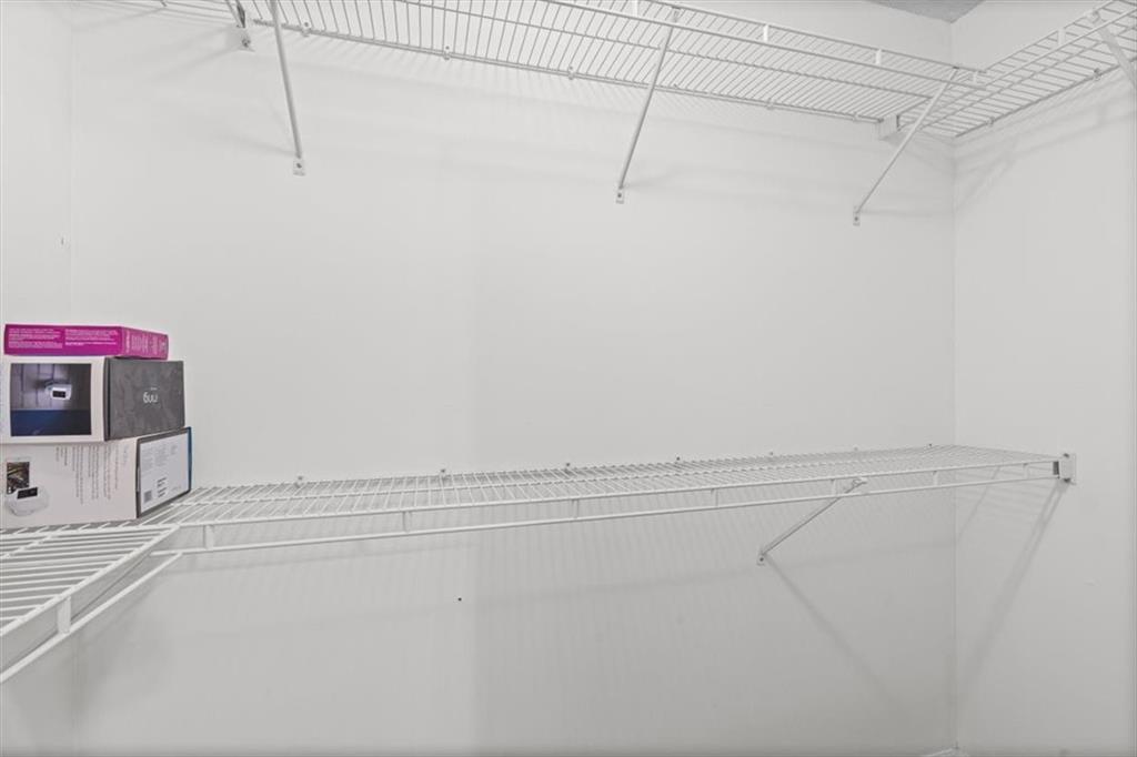 2242 Rocksram Court Buford, GA 30519 - Photo 40 of 52 a view of a walk in closet