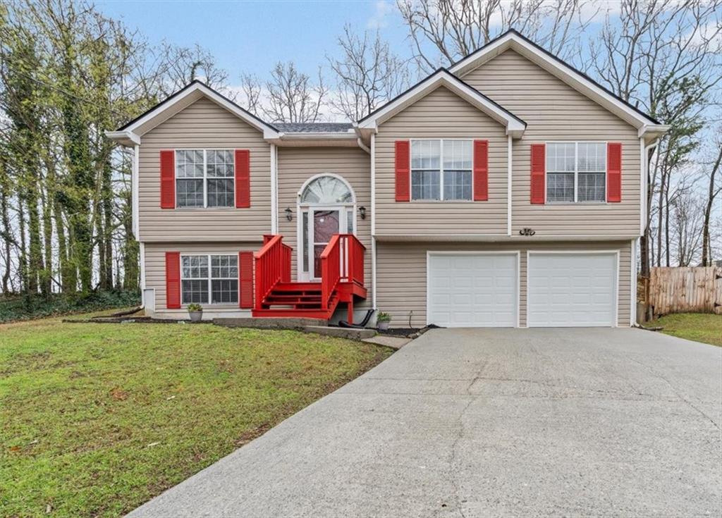 2242 Rocksram Court Buford, GA 30519 - Photo 4 of 52 a view of a house with pool and a yard