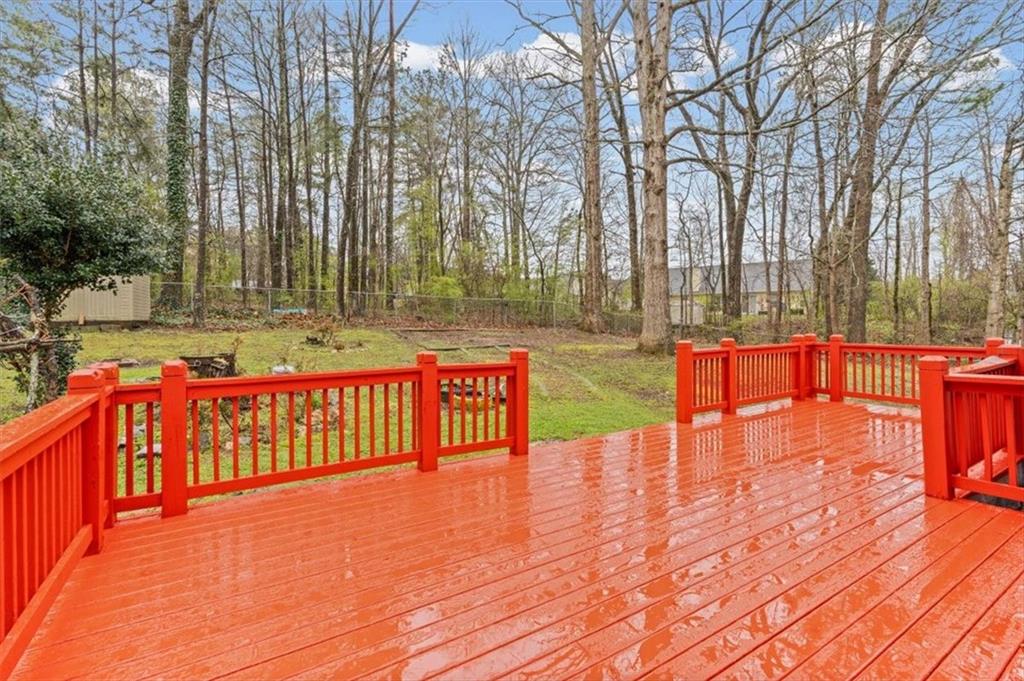 2242 Rocksram Court Buford, GA 30519 - Photo 42 of 52 a view of swimming pool with chairs and wooden fence