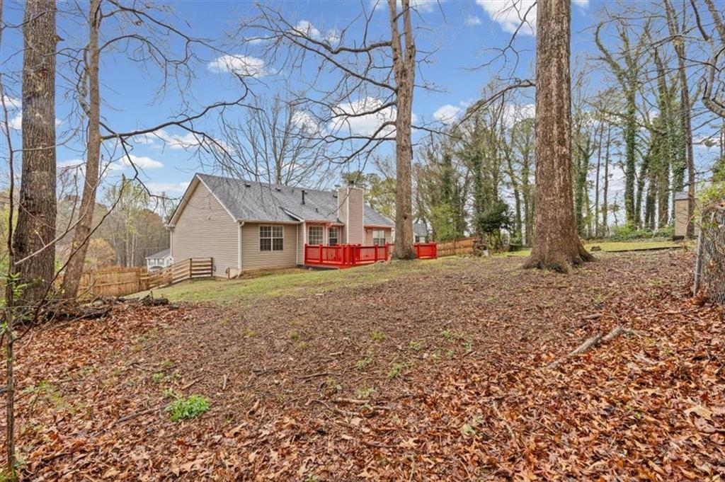 2242 Rocksram Court Buford, GA 30519 - Photo 46 of 52 a view of road with large trees