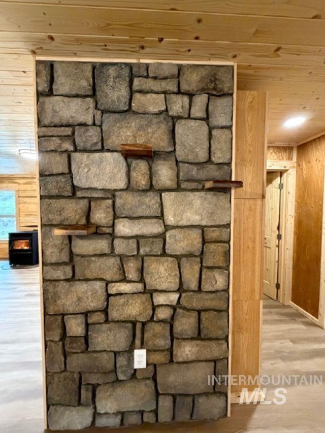 124 Windmill Lane Kooskia, ID 83539 - Photo 17 of 47 Detailed view of wood walls, wood finished floors, and wood ceiling