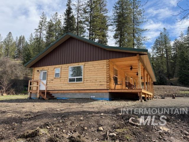 124 Windmill Lane Kooskia, ID 83539 - Photo 3 of 47 View of side of property featuring board and batten siding